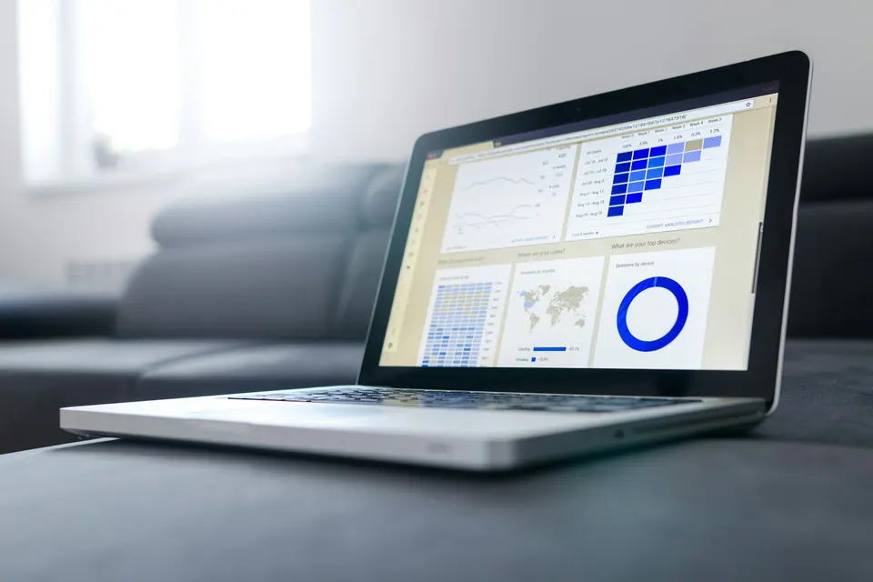 Web analytics by ONS Infosolutions: reports and charts on a laptop